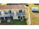 Aerial view of townhouse with private backyard at 11001 Se Sunset Harbor Rd # F45, Summerfield, FL 34491