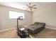 Bedroom with a sofa bed, TV mount, and ceiling fan at 11001 Se Sunset Harbor Rd # F45, Summerfield, FL 34491