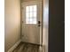 Renovated entryway with white door and wood-look flooring at 11001 Se Sunset Harbor Rd # F45, Summerfield, FL 34491