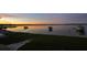 Peaceful lake view at sunset, boats visible at 11001 Se Sunset Harbor Rd # F45, Summerfield, FL 34491