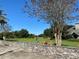 Stone wall along a lush green golf course at 11147 Sw 68Th Ct, Ocala, FL 34476