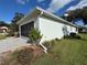 Side view of house showing garage and landscaping at 11147 Sw 68Th Ct, Ocala, FL 34476