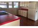 Kitchen boasts red countertops and white cabinets at 1175 Cr 463B, Lake Panasoffkee, FL 33538