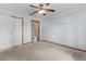 Bedroom with ensuite bathroom and ceiling fan at 11852 Se 71St Ct, Belleview, FL 34420