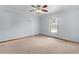 Bright bedroom with ceiling fan and window at 11852 Se 71St Ct, Belleview, FL 34420