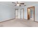 Spacious bedroom with ensuite bathroom and ceiling fan at 11852 Se 71St Ct, Belleview, FL 34420