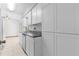Modern kitchen with white cabinets and gray countertops at 11852 Se 71St Ct, Belleview, FL 34420