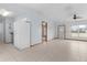 Open concept kitchen with white cabinets and a large refrigerator at 11852 Se 71St Ct, Belleview, FL 34420