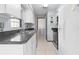 Clean kitchen with white cabinets and gray countertops at 11852 Se 71St Ct, Belleview, FL 34420