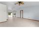Open living area with tile floors and sliding glass doors to backyard at 11852 Se 71St Ct, Belleview, FL 34420