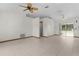 Spacious living area with tile floors and ceiling fans at 11852 Se 71St Ct, Belleview, FL 34420