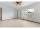 Bright living room featuring tile floors and a ceiling fan at 11852 Se 71St Ct, Belleview, FL 34420