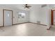Living room with tile floors and a large window at 11852 Se 71St Ct, Belleview, FL 34420