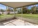 Relaxing screened porch with view of grassy backyard at 11852 Se 71St Ct, Belleview, FL 34420