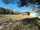 Spacious backyard with pergola, landscaping, and plenty of grass at 15025 Sw 24Th Cir, Ocala, FL 34473