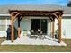 Relaxing patio with pergola, seating area, and grill at 15025 Sw 24Th Cir, Ocala, FL 34473
