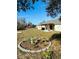 Landscaped backyard with a circular garden and bird bath at 15025 Sw 24Th Cir, Ocala, FL 34473