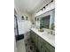 Updated bathroom with double vanity and walk-in shower at 15025 Sw 24Th Cir, Ocala, FL 34473