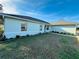 Light teal house with a well-maintained lawn and walkway at 15025 Sw 24Th Cir, Ocala, FL 34473