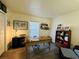 Home office features a large desk, built-in shelving, and hardwood floors at 15025 Sw 24Th Cir, Ocala, FL 34473