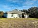 House exterior showcasing a pergola and backyard at 15025 Sw 24Th Cir, Ocala, FL 34473