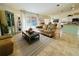 Bright living room featuring a comfortable sofa and access to a backyard patio at 15025 Sw 24Th Cir, Ocala, FL 34473