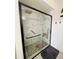Walk-in shower with marble tile and built-in seat at 15025 Sw 24Th Cir, Ocala, FL 34473