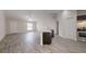 Open living area with vinyl plank flooring and kitchen island at 178 Pine Crse, Ocala, FL 34472