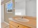 Clean bathroom with single sink vanity and mirror at 3648 Sw 131St Place Rd, Ocala, FL 34473