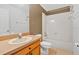 Clean bathroom with wood vanity and shower/tub combo at 3648 Sw 131St Place Rd, Ocala, FL 34473
