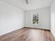 Spacious bedroom with wood-look flooring and large window at 3648 Sw 131St Place Rd, Ocala, FL 34473