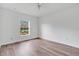 Bright bedroom with wood-look flooring and a window at 3648 Sw 131St Place Rd, Ocala, FL 34473