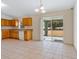 Kitchen with wooden cabinets and a view to backyard at 3648 Sw 131St Place Rd, Ocala, FL 34473