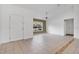 Living room with tile flooring, a door, and large window at 3648 Sw 131St Place Rd, Ocala, FL 34473