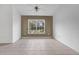 Bright living room featuring tile flooring and a large window at 3648 Sw 131St Place Rd, Ocala, FL 34473