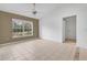Living room with tile floor,accent wall and a door to hallway at 3648 Sw 131St Place Rd, Ocala, FL 34473