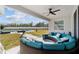 Circular patio furniture with comfortable seating and a view of the pool and backyard at 4812 Se 37Th St, Ocala, FL 34480