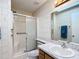 Bathroom with shower and updated vanity at 5032 Se 108Th St, Belleview, FL 34420