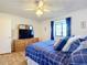 Bedroom with a queen-size bed and built-in TV stand at 5032 Se 108Th St, Belleview, FL 34420
