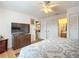 Spacious bedroom with large bed, TV, and ample closet space at 5032 Se 108Th St, Belleview, FL 34420