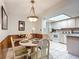 Cozy dining area next to kitchen with round table and chairs at 5032 Se 108Th St, Belleview, FL 34420