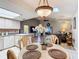 Bright dining area with a round table and view into the living room at 5032 Se 108Th St, Belleview, FL 34420