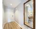 Light and airy entryway with wood-look floors and a large ornate mirror at 5032 Se 108Th St, Belleview, FL 34420