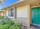 Green door entrance with brick and siding exterior at 5032 Se 108Th St, Belleview, FL 34420