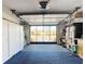 Attached garage with storage cabinets and laundry area at 5032 Se 108Th St, Belleview, FL 34420