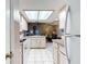 Clean kitchen featuring white cabinets and view to living room at 5032 Se 108Th St, Belleview, FL 34420