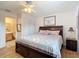 Spacious main bedroom with king-size bed and ensuite bathroom at 5032 Se 108Th St, Belleview, FL 34420