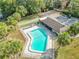 Community pool with adjacent building and lawn at 5032 Se 108Th St, Belleview, FL 34420
