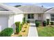 Neat walkway leads to the front entrance of this single story home at 505 Kempton Pl, The Villages, FL 32162