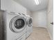 Bright laundry room with Samsung washer and dryer at 505 Kempton Pl, The Villages, FL 32162